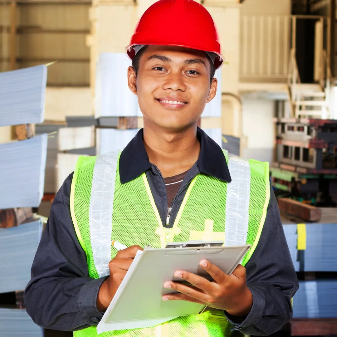 smiling young man printers print house Disability DIAP young man with clipboard book clothing engineer fashion accessory hard hat hat helmet human face laptop person wearing